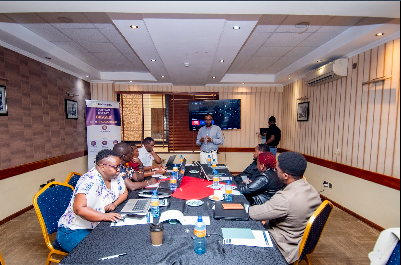 Ndovesha team member guiding a participant through the platform
