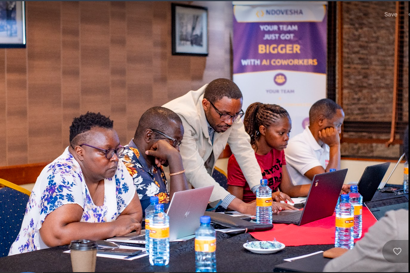 Participants reviewing their build on a laptop during the masterclass